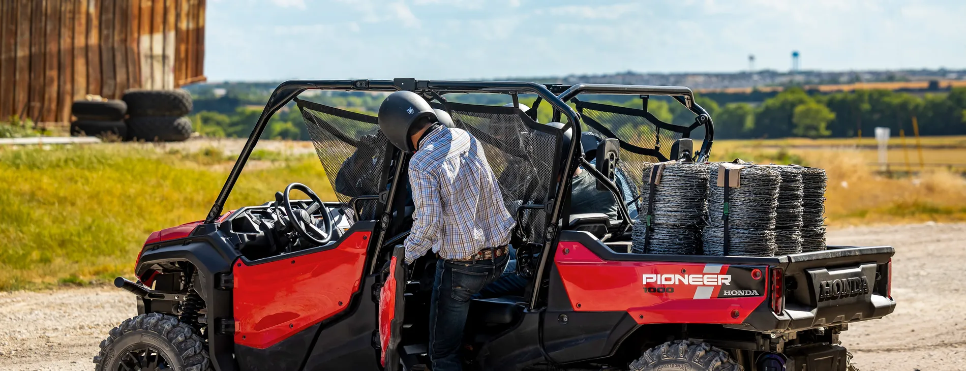 Honda Pioneer 1000-6 Deluxe Crew loaded with fencing supplies